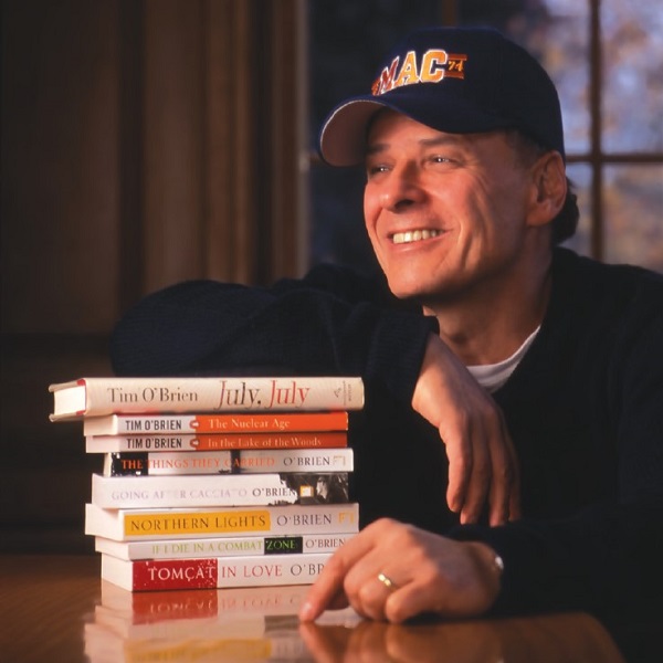 Tim O'Brien seated with his books like July, July and The Things They Carried