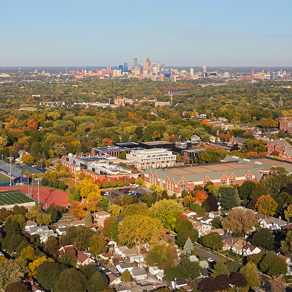 Aerial photo of Macalester's campus with the Minneapolis skyline in the distance