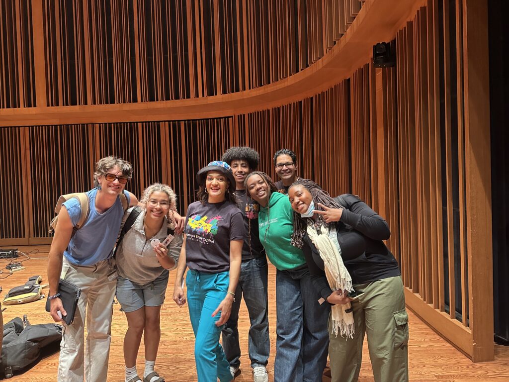 Pictured here are Timotei Chas '27, Maia Tazewell '27 (member of the African Music Ensemble), María Isa, Hareth '27, Chantal Pangula '26, Alex Santos (María Isa's band – Latin percussion), and Iris Fokam Signe '26 (member of the African Music Ensemble).