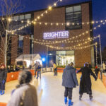 Mac community members skate across the ice rink at the Brighter campaign launch event.