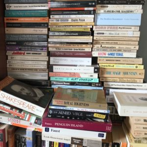 stacks of books in APBP's office