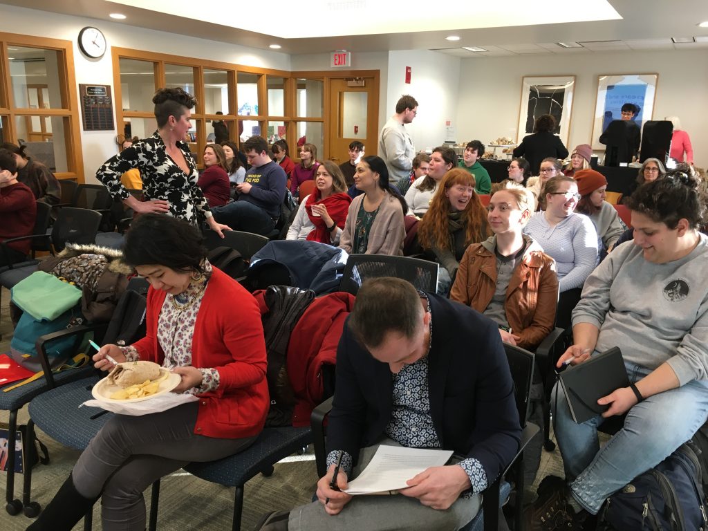 Professor Hobgood mingles with audience members