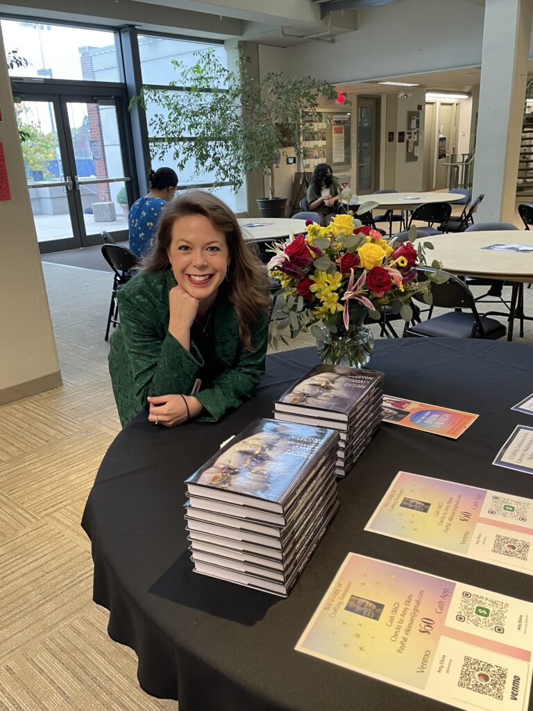 Dr. Elkins with copies of her book