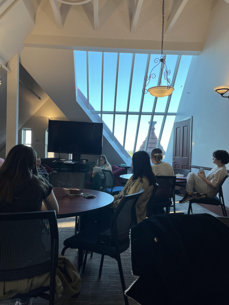 Students listen as Professor Andrea Kaston-Tange reads from her latest project.