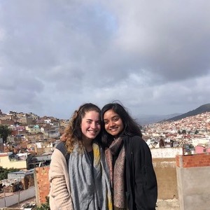 Mina and a friend in front of the Granada skyline